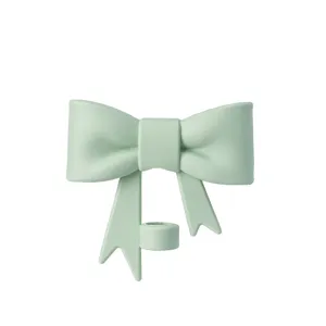 Close-up detail view of the cute light green silicone bow straw topper accessory, perfect fit.