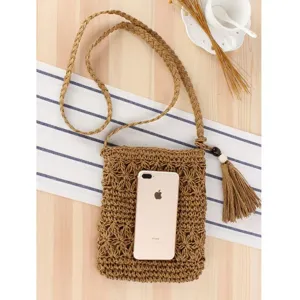 Handwoven straw crossbody bag for women, stylish phone bag with tassel and long strap.