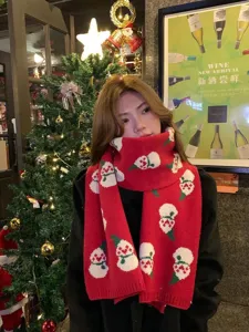 Christmas red knitted winter scarf with cute white snowman pattern, cozy and warm holiday gift.