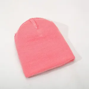 Pink knitted beanie for daily warmth, soft texture detail showing fine winter hat craftsmanship.