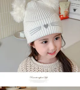 Kids winter knit beanie hat with cute fluffy pom poms and cat embroidery for girls.