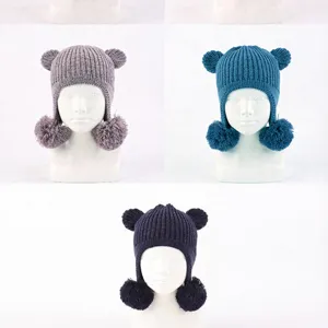 Cute autumn knit hat featuring adorable bear ears and dual pom pom earflaps for women girls.