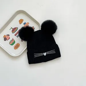 Kids winter knit beanie hat with double pom poms, cute cat whiskers design, warm and stylish.