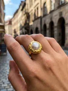 Vintage gold plated pearl ring with textured metal design, elegant and stylish open ring.