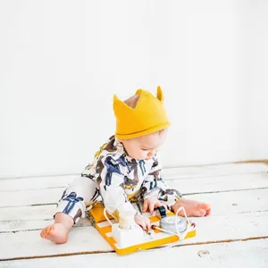 Cute baby crown knitted hat detail shot, soft wool material, perfect for infant daily wear.