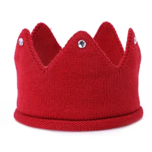 Red knitted crown headband detail, soft wool infant hair accessory with sparkling rhinestones.