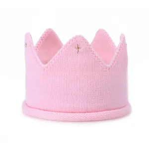 Pink knitted baby crown headband, soft infant wool crown hair accessory for cute styling.