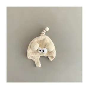 Cute winter baby plush earflap hat with funny eyes, thick warm infant skull cap for cold days.