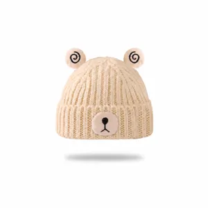 Cute baby knitted beanie with bear ears and lovely face patch, warm winter hat for toddlers.