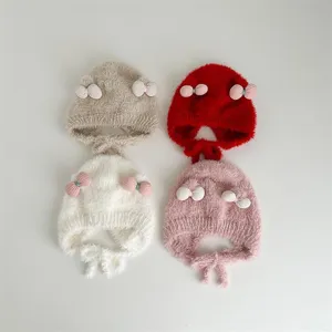 Schattige baby winter dikke pluche gebreide muts met strikjes, warme winddichte oorklep muts.