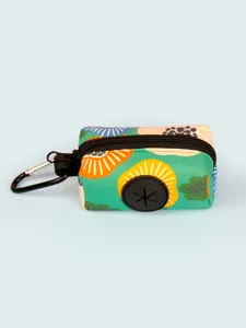 Portable dog waste bag dispenser with floral print and carabiner hook for outdoor pet walking.