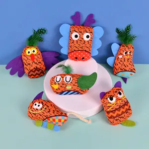 Detailed view of colorful plush cat toys set with cute animal shapes, feathers and felt wings.