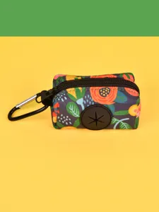 Portable dog waste bag dispenser with vibrant floral pattern and durable metal carabiner.
