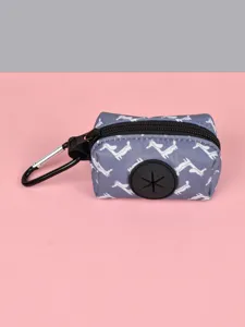 Portable dog poop bag dispenser with cute dog pattern, zipper closure, and metal hook.