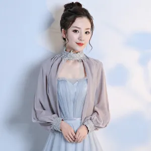 Chiffon bolero shawl detail, sheer long sleeves and delicate lace high collar design.