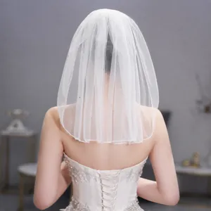 Short white bridal veil with delicate rhinestones, perfect for wedding and photo shoots.