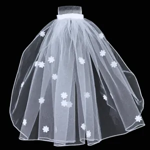White short bridal veil with comb and floral appliques for wedding photography details view.