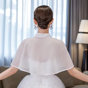 Detailed view of women white chiffon shawl capelet back view elegant wedding dress wrap.