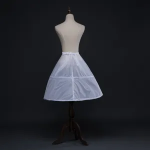 Detailed view of a white fluffy petticoat crinoline with hoop structure for dress volume.