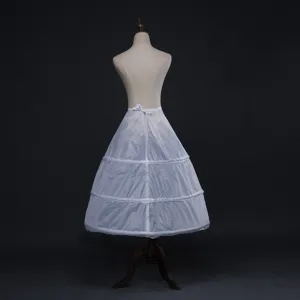 White bridal petticoat detail showing waist tie and multi-tier structured steel rings.