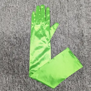 Green satin long gloves detail view, elegant over elbow evening party accessory texture.