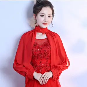 Red chiffon shawl detail shot, elegant long sleeve cape for evening dress or wedding wear.