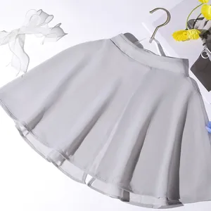 Detailed view of light grey chiffon pleated mini skirt, elegant lightweight fabric design.