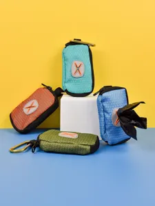 Portable pet waste bag dispenser with carabiner, lightweight and multi-functional design.