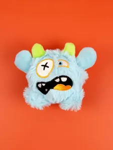 Cute funny plush monster pet toy with soft blue fur and green horns for dogs and cats play.