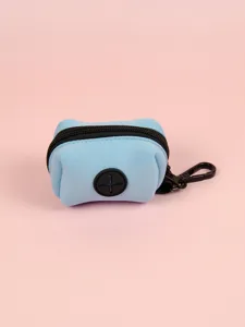 Mini blue neoprene dog waste bag dispenser detail, durable zipper and black carabiner clip.