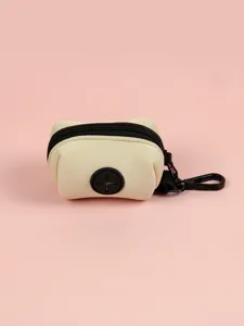 Neoprene dog poop bag holder detail showing compact design and secure black zipper closure.