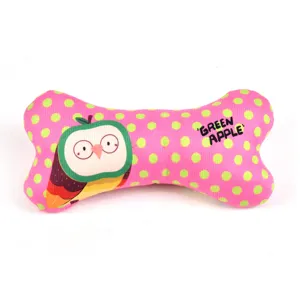 Pink polka dot dog chew bone toy detail featuring cute cartoon owl and green apple text.