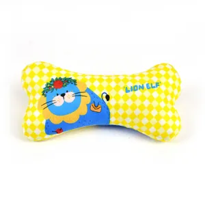 Close-up of yellow checkered bone-shaped pet dog chew toy with cute cartoon lion print.