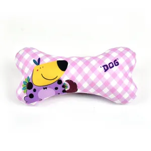 Detail view of pink plaid bone dog chew toy showing cute cartoon puppy print and soft fabric.