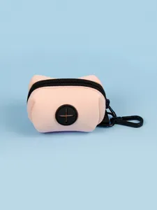 Detail view of the pink neoprene dog waste bag holder with black zipper and handy hook.