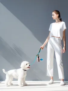 Detailed view of the portable dog leash and pink poop bag dispenser set for daily walking pets.