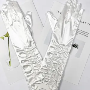 Detailed shot of white satin ruched long gloves, elegant wedding evening etiquette design.