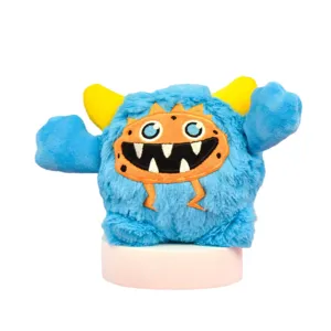Cute blue monster plush pet toy with yellow horns and orange face for dogs.