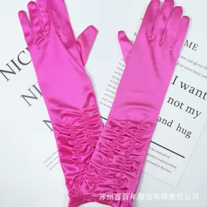 Pink satin pleated long gloves detail, elegant evening party and bridal accessory style.