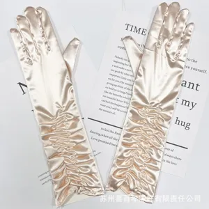 Champagne pink satin pleated long gloves detail, elegant bridal wedding accessories.