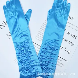 Blue satin ruched long gloves detail shot, elegant bridal evening dress accessory.