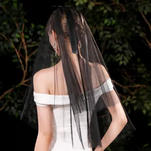 Details of the black bridal wedding veil featuring a double layer and elegant large bow ribbon.