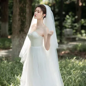 Elegant white bridal veil long double layer wedding veil minimalist style veil detail.