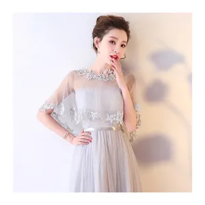 Elegant bridal lace cape and grey strapless dress set for wedding parties and evening events.