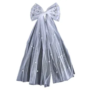 Elegant white mesh bow hair clip with pearls and long ribbons for bridal wedding accessories