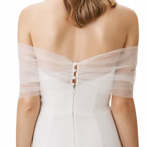 Bridal off-the-shoulder sheer tulle wrap with pearl buttons, elegant ivory wedding shawl.