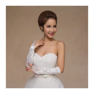 Elegant white lace fingerless bridal gloves for wedding dress and special event styling.