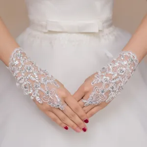 Elegant white lace fingerless bridal gloves with crystal beads, perfect for weddings.