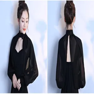 Detailed view of the black chiffon sheer shawl featuring long sleeves and high lace collar.