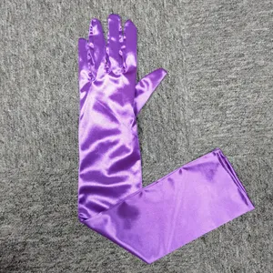 Purple satin long evening gloves detail shot, elegant shiny fabric accessory for formal events.